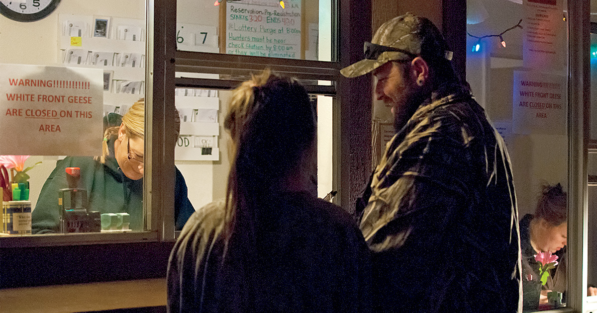 People buying hunting tags. Photo by James Leash/Sharp-EyeImages.com.jpg